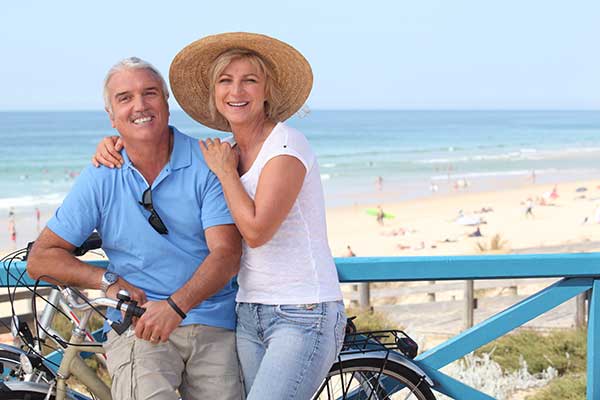 mature dating couple on a bike